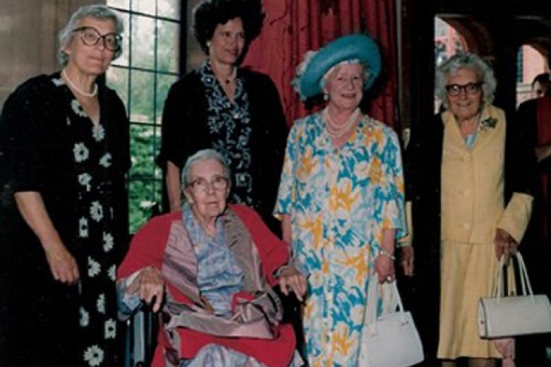 The Queen Mother (Visitor 1948-2002) with four Girton Mistresses, from left Mary Warnock, Mary Cartwright, Juliet Campbell and Muriel Bradbrook.