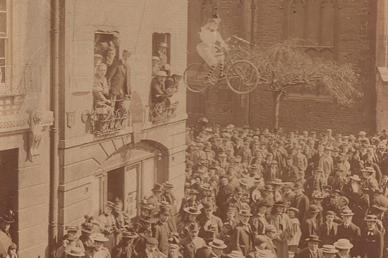 Effigy of a female student hanging from the window in the centre of Cambridge during the protests of 1897, taken by Messrs Stearn (archive reference: GCPH 9/1/4)