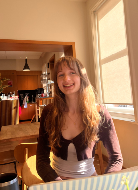 Amelia sat in the Social Hub at Girton