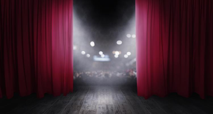 The red curtains are opening for the theatre show