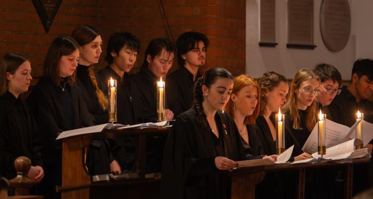 Members of Girton Choir singing in Girton College Chapel