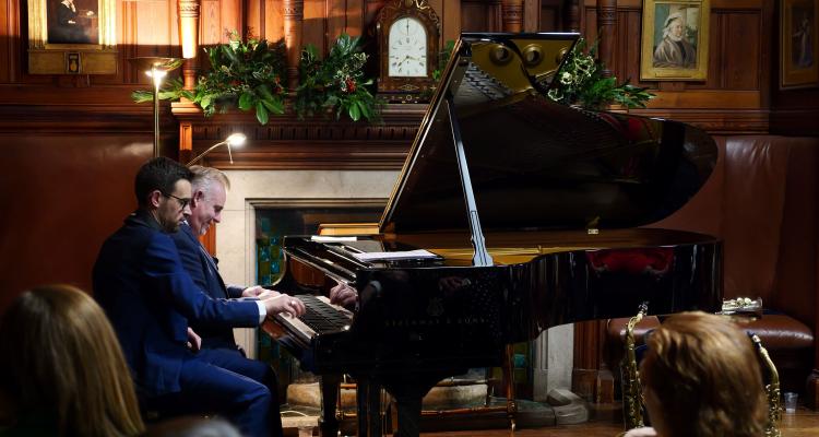 Tim Boniface and James Pearson performing at Winter Guest Night in 2023 