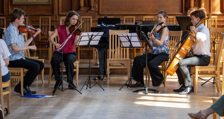 Students performing in Great Hall at the GCMS May Week Concert 2026