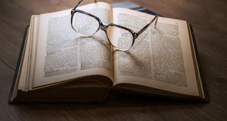 Image of book with glasses