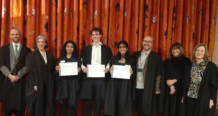 2024 Ridding Reading Prize winners with the judges. winners are holding certificates 