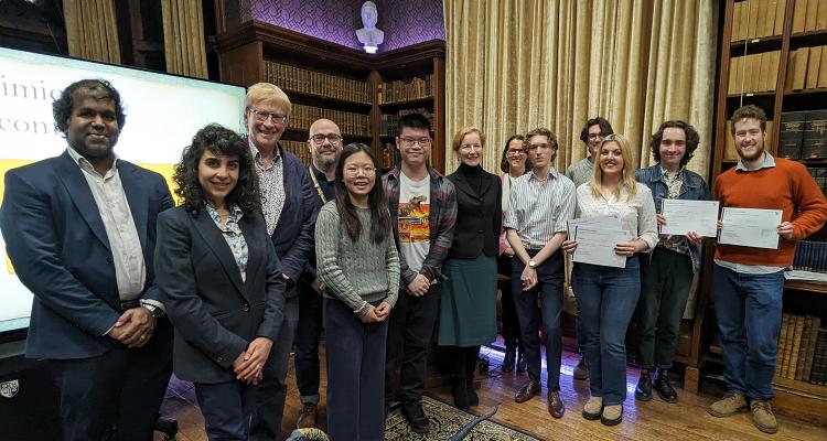 Judges with the participants of the 2024 Hammond Science Communication Prize. The winners are posing with their certificates 