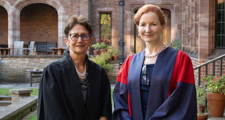 Professor Neena Modi with Dr Elisabeth Kendall in Eliza Baker Court at Girton College, University of Cambridge