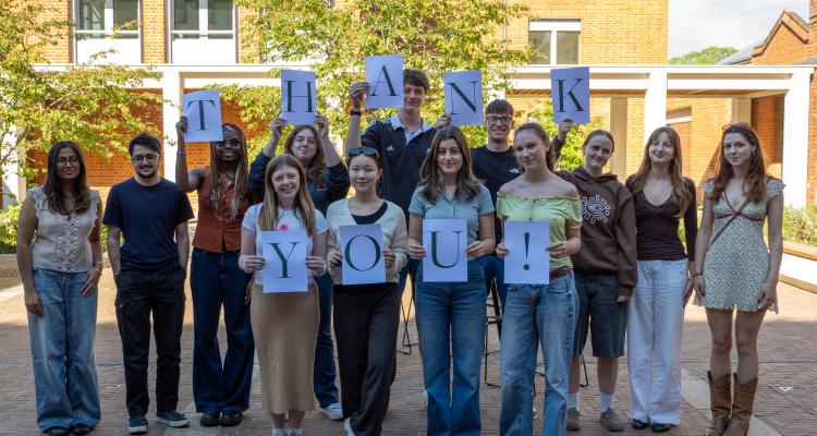 Telethon callers holding thank you sign