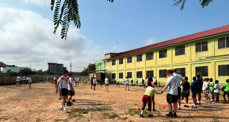 Cambridge students leading an after-school rugby session at Future Leaders School. (Photo credit: Matthew Cormack)