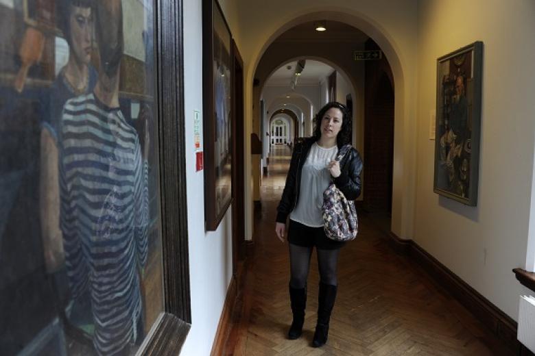 Visitor viewing the People’s Portraits collection at Girton College, 2015