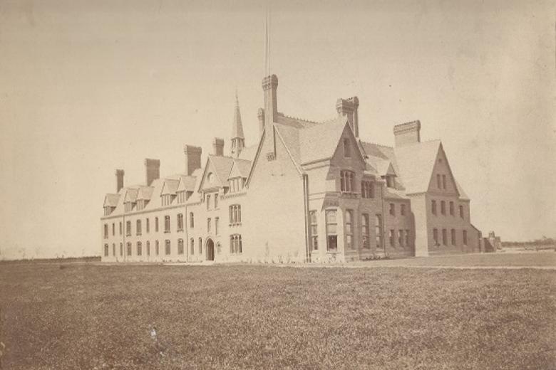 The first building at Girton, circa 1873. It shows the blank wall where the Stanley Library is later added, and the bay window of the Hall (now Old Hall) funded by Lady Stanley (archive reference: GCPH 3/1/5)