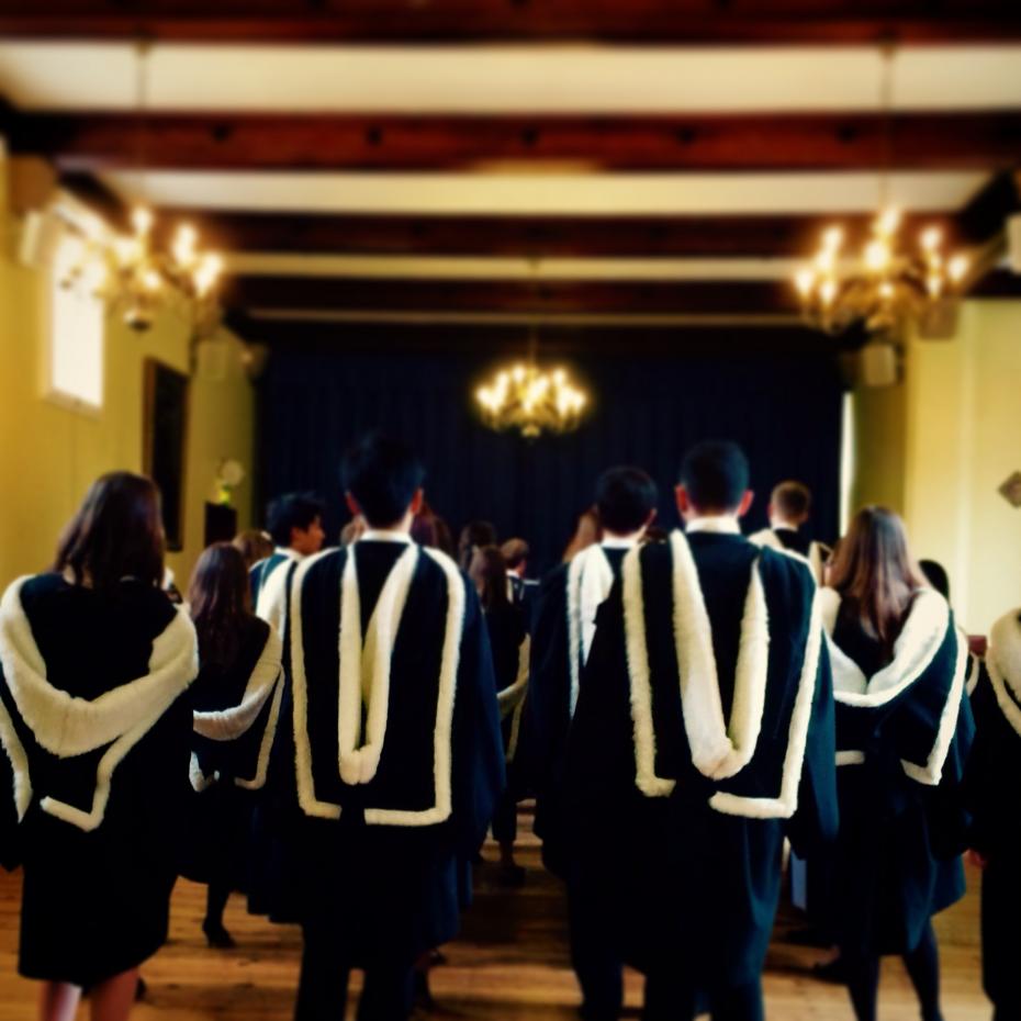 Students wearing academic dress in Old Hall