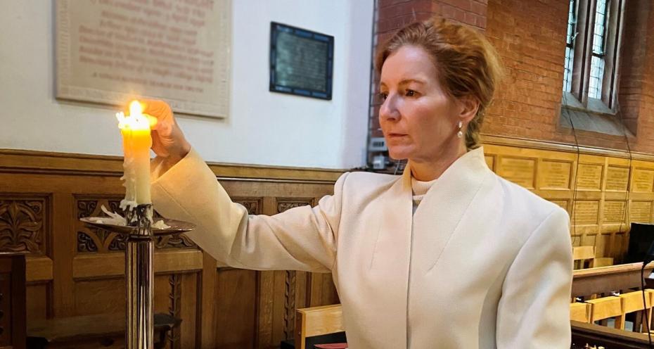 The Mistress, Dr Elisabeth Kendall, lighting a candle in Chapel