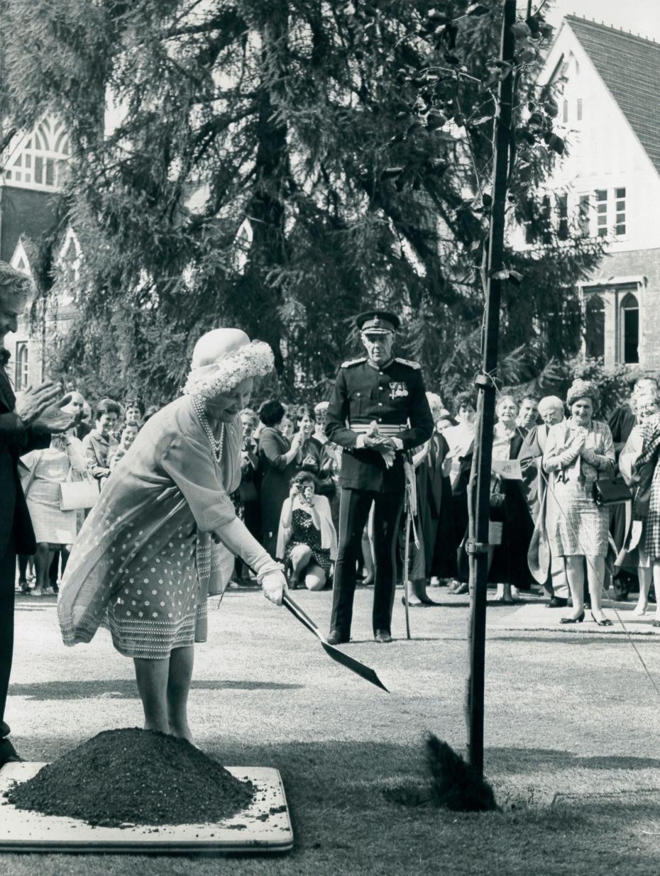 Her Majesty Queen Elizabeth, the late Queen Mother, plants a tree to commemorate Girton’s centenary, 10 June 1969 (photograph credit: Cambridge News; archive reference: GCPH 10/17/16)
