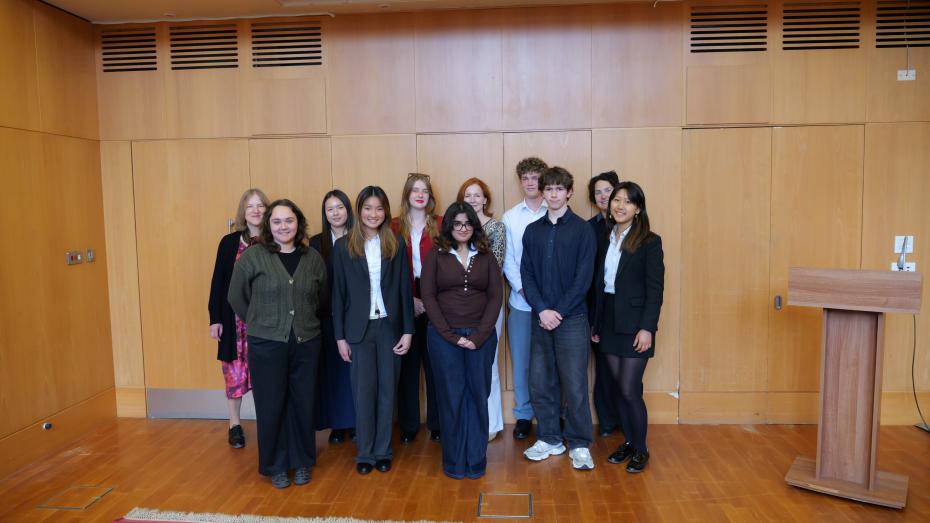 The group of winning entrants stands with the Mistress of Girton College, Dr Caroline Brett, and Dr Helen Van Noorden.