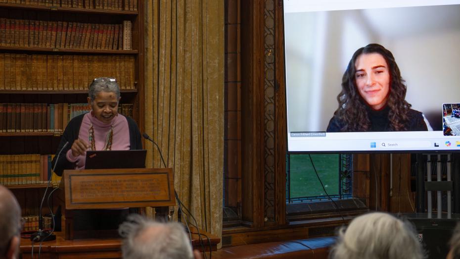 Carson Eckhard, overall winner of the prize listens via video link to judges' remarks on her work